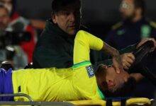 A tearful Neymar leaving the pitch on a stretcher