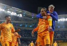 Captain Virgil van Dijk celebrates with his teammates after scoring the vital winner