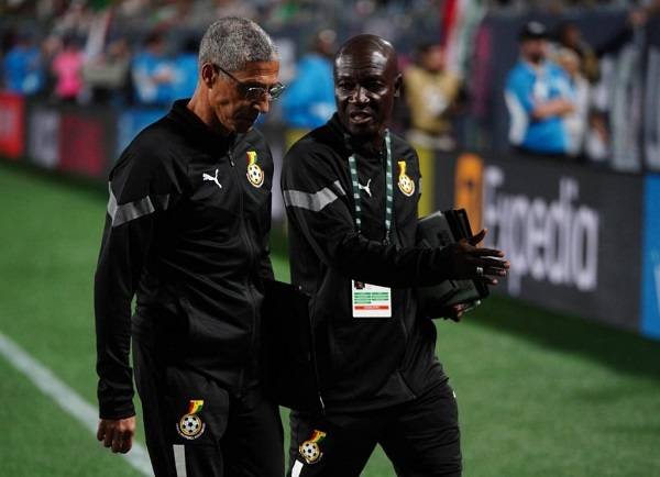 Chris Hughton (left) and his Didi Dramani, one of his assistants