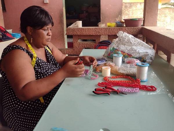 Ms Ashiboe, who has lived experience, engaged in bead work.