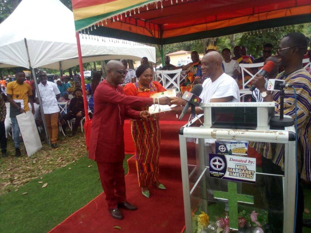 Justice Jones Dotse (second from right) presenting a gift  to Justice Gaewu