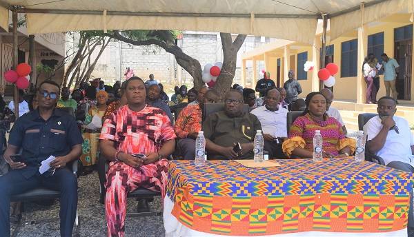 Mr Solomon Kotey Nikoi (seated middle) and other dignitaries at the event with the block in the background Photo: Stephanie Birikorang