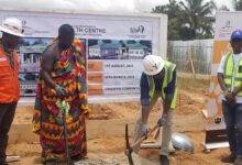 • Mr Emmanuel Baidoo (second from right) cutting the sod for the commencement of the project