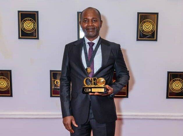 • Mr Clyde Adjei displaying the award