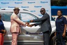 Mr Gyebi (second from right) presenting keys to the vehicle to Dr Addai-Poku