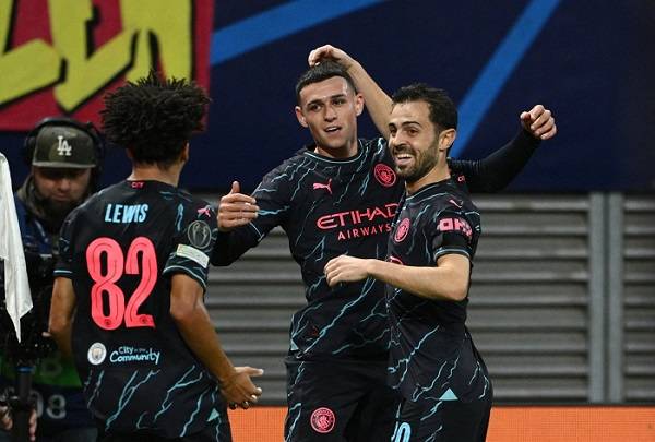 • Phil Foden (middle) celebrating his goal with Lewis and Silva