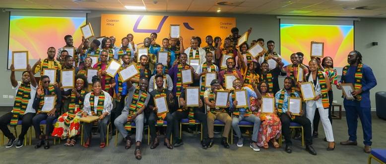 Trainees displaying their certificates