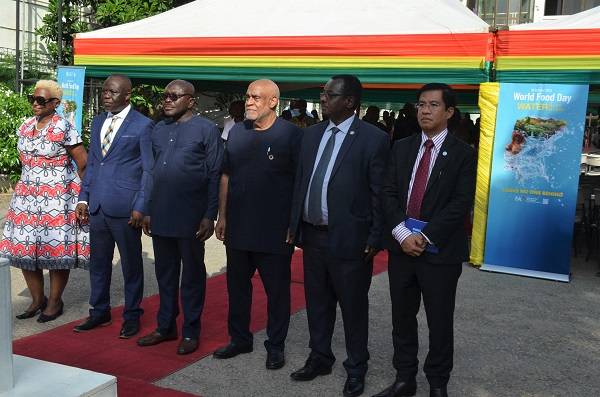 Mr Yaw Frimpong Addo(second from left),and Mr Charles Abani(third from right)with other dignitaries after hoisting Ghana and UN flags. Photo Godwin Ofosu-Acheampong
