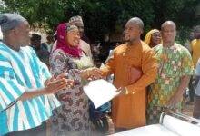 (inset)Dr Abass Ganiu(seond from right) presenting the items to Hajia Lariba Abudu Zuweira