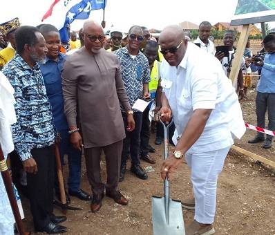 • Mr Quartey (with shovel) breaking grounds for commencement of the Hospital project