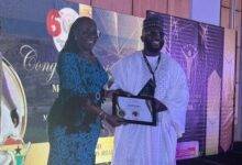 • Alhaji Osman receiving a certificate of honour from Mrs Usula Owusu Ekuful, Minister for Communications and Digitalisation