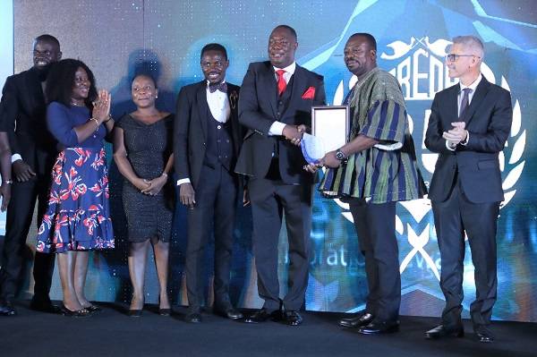 • Dr Ayiku (third from right) receiving the award
