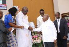 President Akufo-Addo (right) congratulating Rt Rev. Professor Mante during the valedictory service