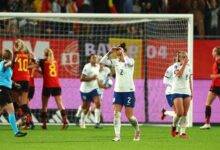 • English players (right) walking off dejected while the Belgians celebrate the thrid goal