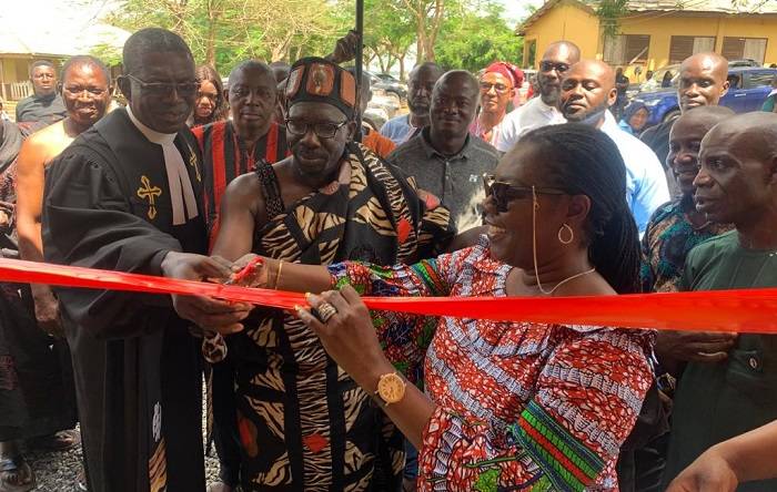 • Inset: Mrs Owusu-Ekuful (right), cutting tape with Osabarima Appenteng II to commission the facility