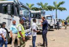 Mr Amine Kabbara (right) ushering guests to the Foton trucks