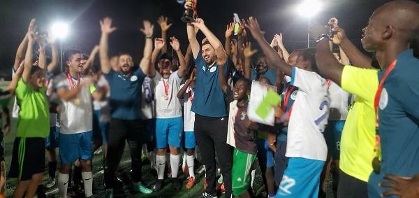 • Mr Taleb celebrating with his team after winning their maiden trophy