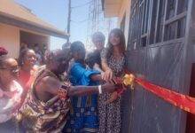 Nii Tetteh Obroni joined by other guests to cut the tape for the health facility
