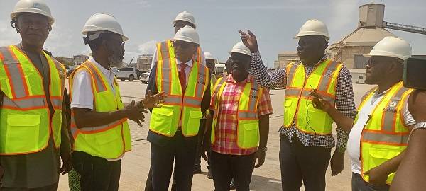• Mr Komla Mensah (second from right), Project Engineer, Takoradi Port, briefing Mr Asiamah (third from right) and the delegation during the visit