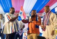 President Akufo-Addo (middle) presenting NPP flag to the Flagbearer-elect, Dr. Mahamudu Bawumia after the election.Looking on is Mr Stephen Ayensu Ntim