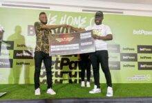• Proud winner Fuseni (left) receiving his dummy cheque from Mr Badu