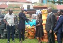 Mrs Armah (fifth from right) presenting some of the items to Mr Adzah