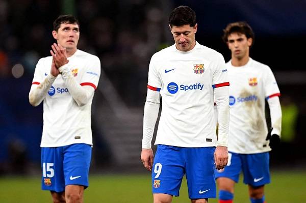 • Barcelona players walking off the field dejcted after the game.