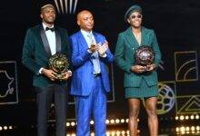 • CAF president Patrice Motsepe (middle) together with Osimhen and Oshoala at the ceremony