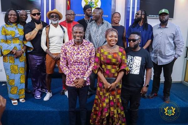 • Mr Mark Okraku-Mantey (left) with the members of the Creative Arts Agency after the briefing