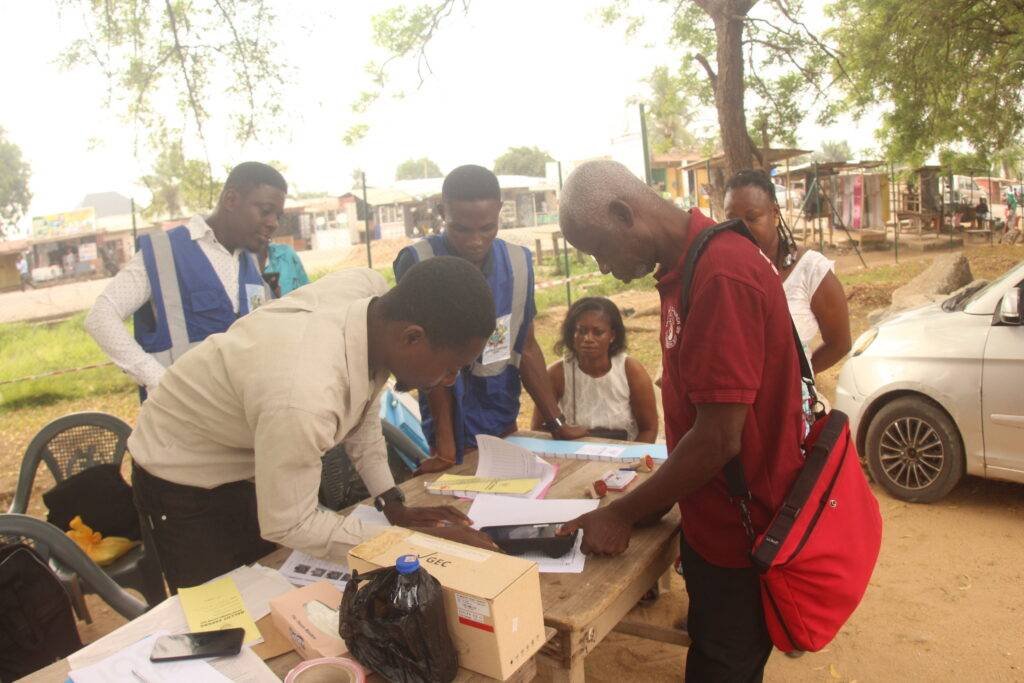 EC electoral officer verifying a voter at Oduman Polyclinic, Nsakina Electoral Area in Accra. Photo. Ebo Gorman   