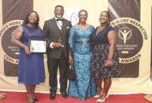 • Dr Andy Osei Okrah with Mrs Ursular Owusu-Ekuful, (second from right), His wife, Alice and daughter Hilary (right)