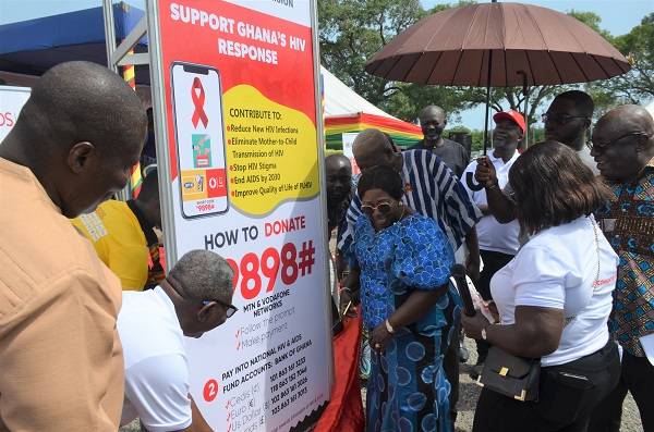 • Mrs Akosua Fremah Opare (middle) with other dignitaries unveiling the Support Code for Ghana HIV Response Photo: Godwin Ofosu-Acheampong