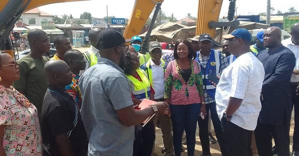 . Mr Amoako-Atta (right) interacting with engineers at one of the project sites