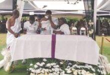 Mr Ansa-Asare and her siblings paying their last respect to their father