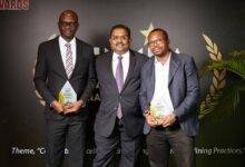 • Mr Adjettey (left) and Mr Kumar (middle) displaying the awards