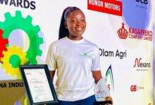 Ms Twumasi displaying the award