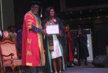 • Dr Mensa Otabil presenting a certificate to a graduand