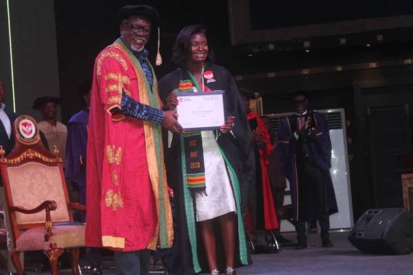 • Dr Mensa Otabil presenting a certificate to a graduand