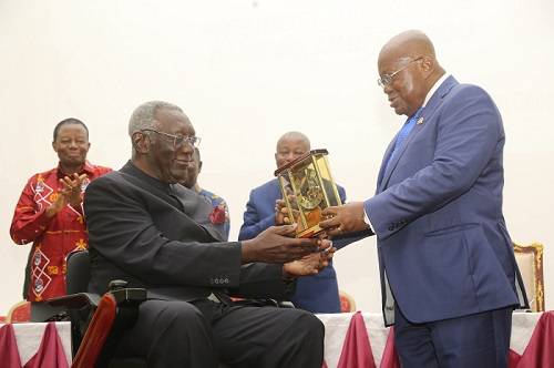 President Akufo-Addo (right) presenting an award to Former President Kufour at the programme