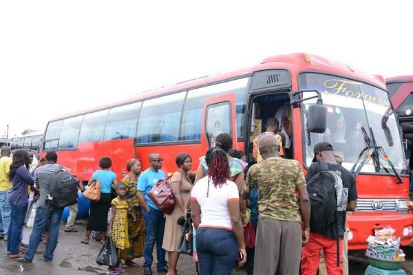 Some commuters boarding a bus to their destinations