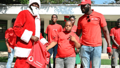 Vodafone Ghana Foundation team handing over gifts to the students
