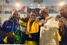 Former President Mahama with the Ashanti Warrior and members of his technical team after the fight