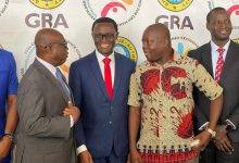 • Rev. Dr Owusu-Amoah (middle) in a chat with the Board Chairman of GRA, Tony Oteng-Gyasi (left), and Executive Secretary of the Importers and Exporters Association, Sampson Asaki Awingobit (right)