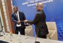 Mr Hesse (left) exchanging the partnership agreement with Mr Uaboi