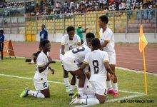Members of the Black Princesses celebrate after scoring one of the goals