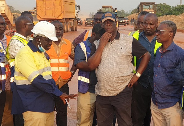 Mr Amoako-Atta(second from right) with his team inspsecting one of the projects