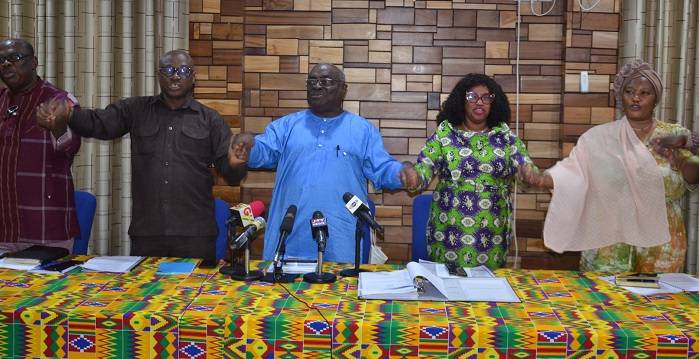 Mr Mark Dankyira Korankye (middle) with other Executive members join hands to sing the patriotic song after the media briefing Photo: Godwin Ofosu-Acheampong