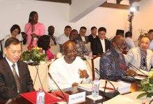 Mr Ken Ofori-Atta (second from left) interacting with Ambassador Lu Kun (left) at the programme. Photo. Ebo Gorman