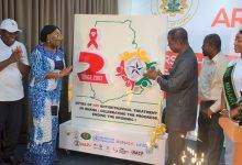 • Dr Patrick Kuma Aboagye (third from right) and Dr Mokowa Blay Adu-Gyamfi (second from left), Presidential Advisor on HIV/AIDS, and others applauding after unveiling the logo Photo: Godwin Ofosu-Acheampong