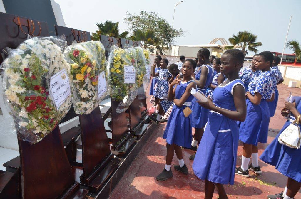 •
Students scribbling down some notes after the wreath-laying ceremony
•
Photo: Godwin Ofosu-Acheampong